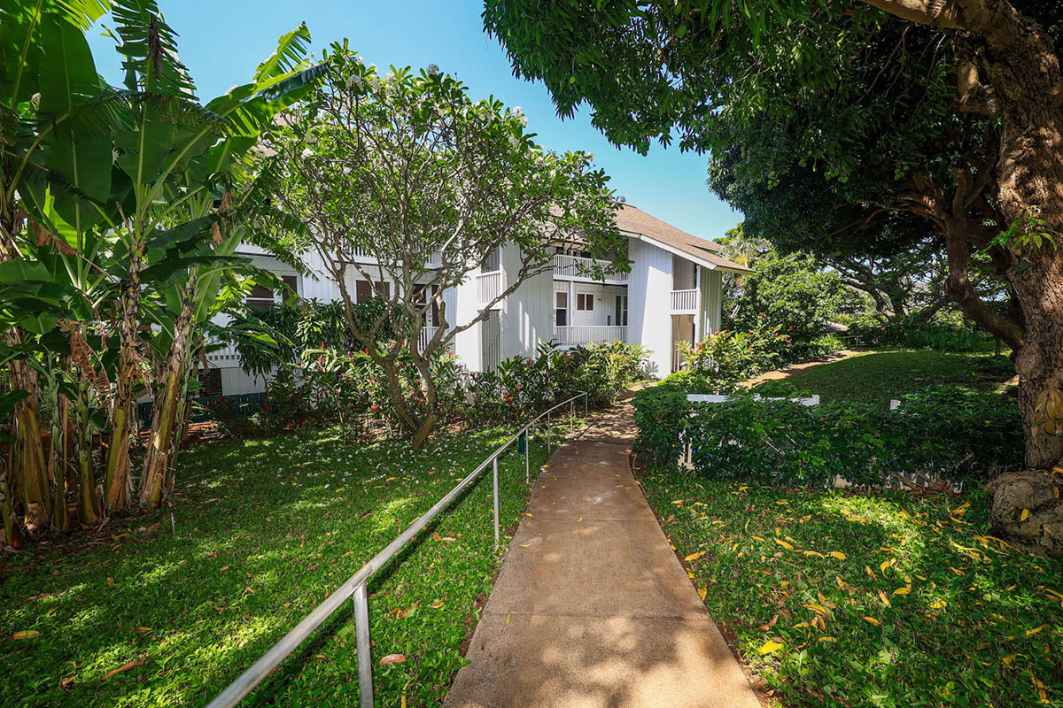 2253 Poipu Road, Unit 230 Koloa, HI 96756 - Photo 19 of 27 a view of a pathway of a house with a yard