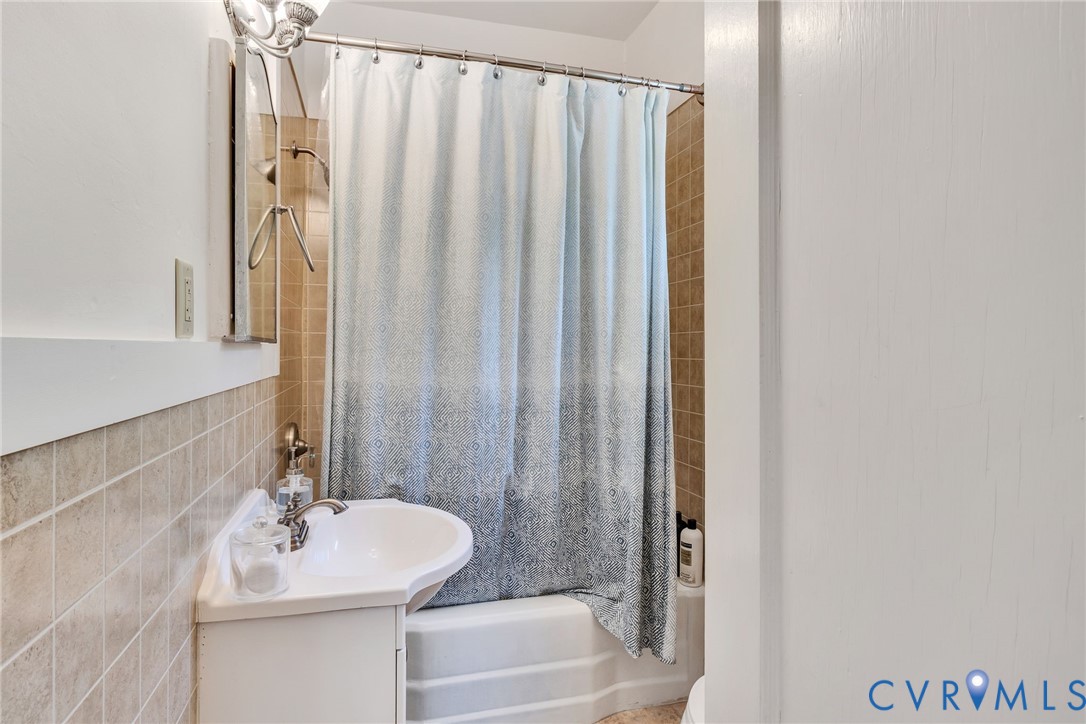 430 Harveys Neck Road Heathsville, VA 22473 - Photo 40 of 51 White corner vanity with an integrated sink and ch