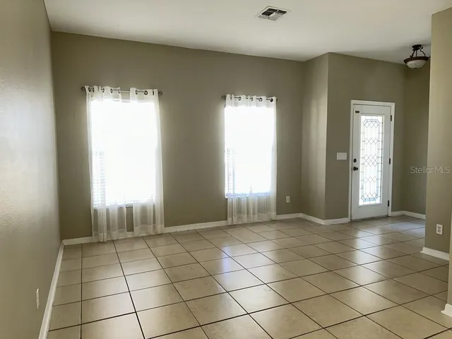 a view of an empty room and window