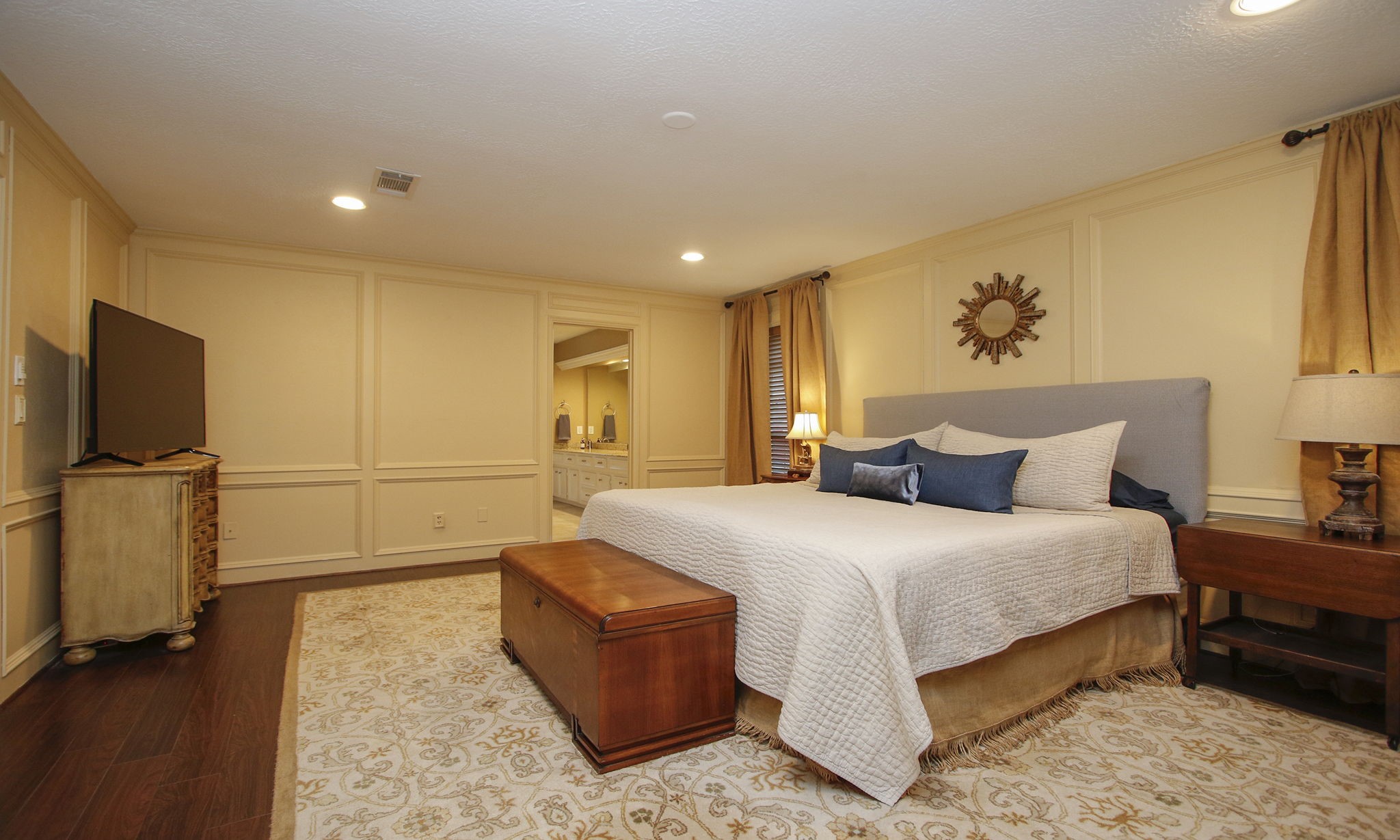 9546 Enstone Circle Spring, TX 77379 - Photo 18 of 44 Primary bedroom is charming with luxury vinyl floors.