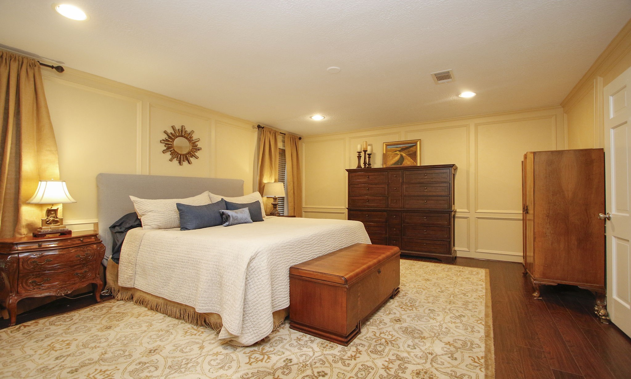 9546 Enstone Circle Spring, TX 77379 - Photo 19 of 44 a spacious bedroom with a bed and a dresser
