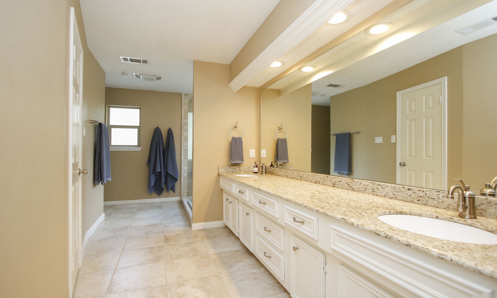 9546 Enstone Circle Spring, TX 77379 - Photo 20 of 44 Primary bathroom has been remodeled with a large walk in shower and larger closet.