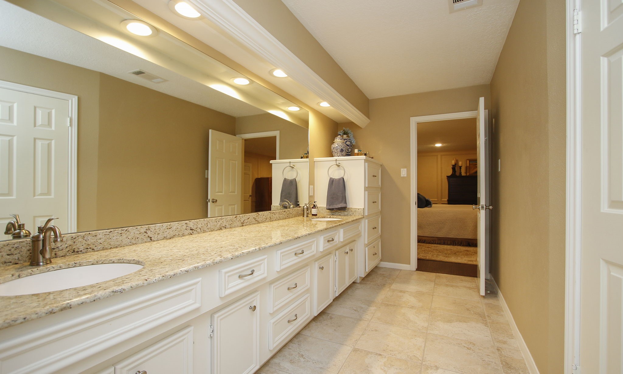 9546 Enstone Circle Spring, TX 77379 - Photo 21 of 44 a spacious bathroom with a granite countertop sink mirror and bathtub