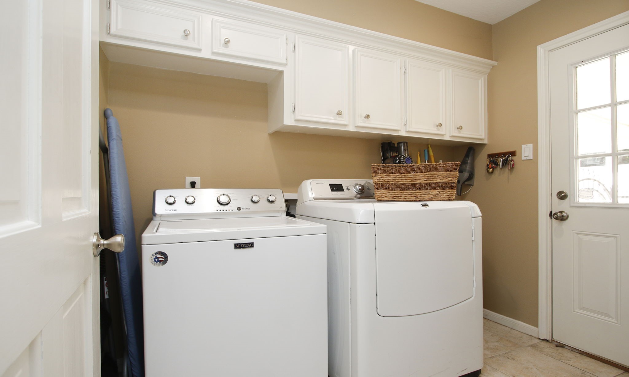 9546 Enstone Circle Spring, TX 77379 - Photo 24 of 44 The laundry room off the kitchen offers great storage.
