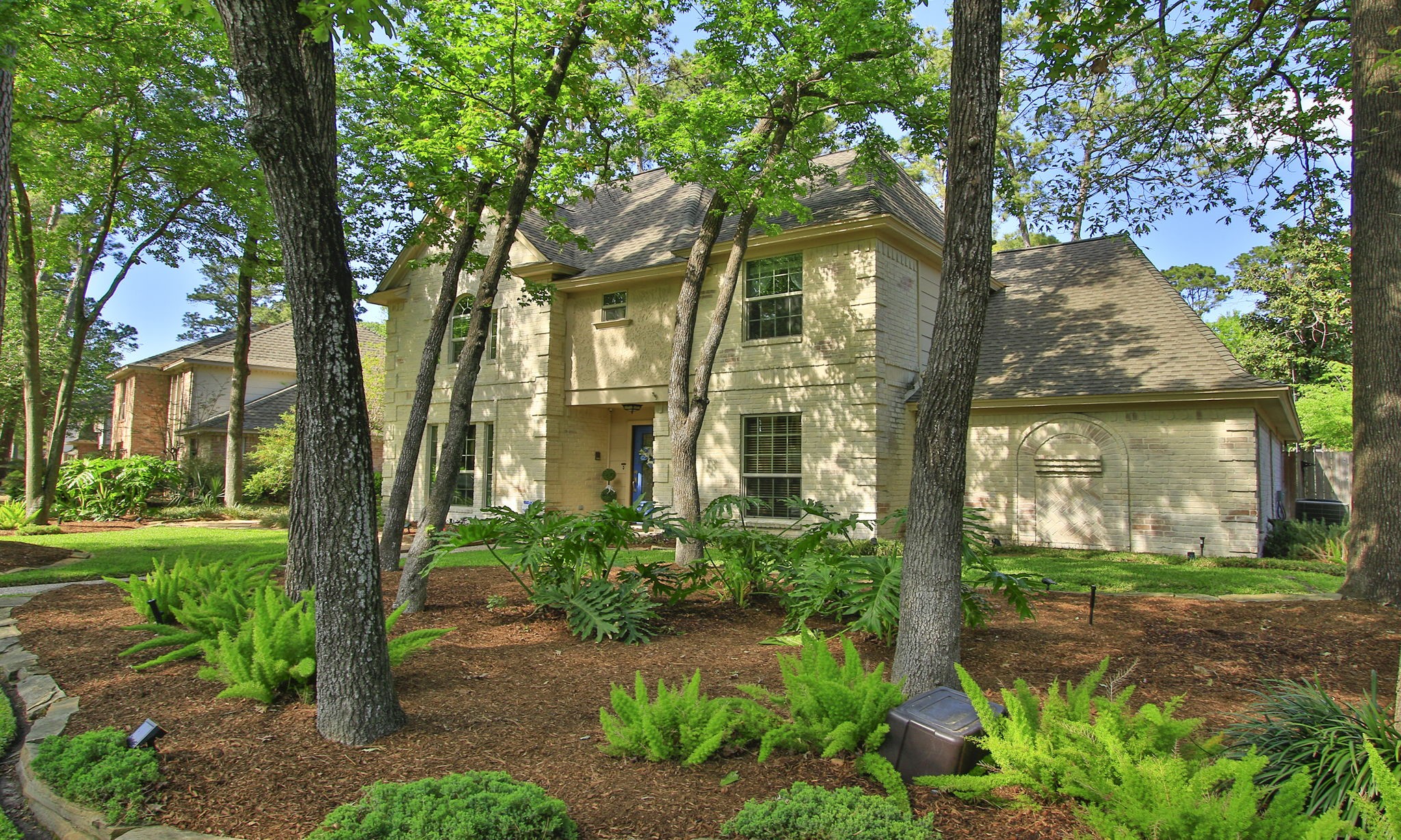 9546 Enstone Circle Spring, TX 77379 - Photo 3 of 44 Brick painted with the German "Schmear" technique - This light brick exterior is complemented by lush landscaping, a lovely manicured lawn and double pane windows throughout.