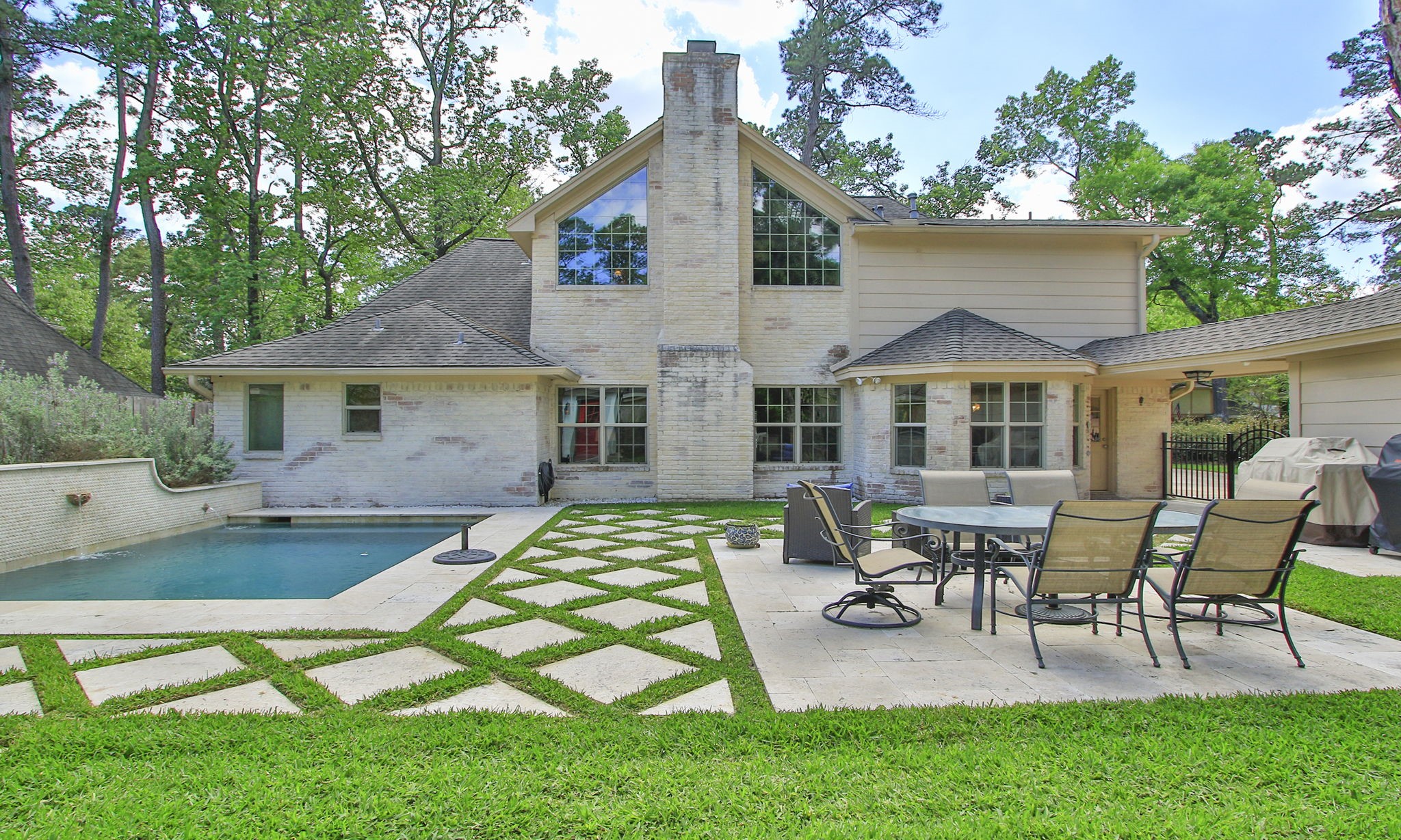 9546 Enstone Circle Spring, TX 77379 - Photo 39 of 44 a view of a house with backyard sitting area and garden