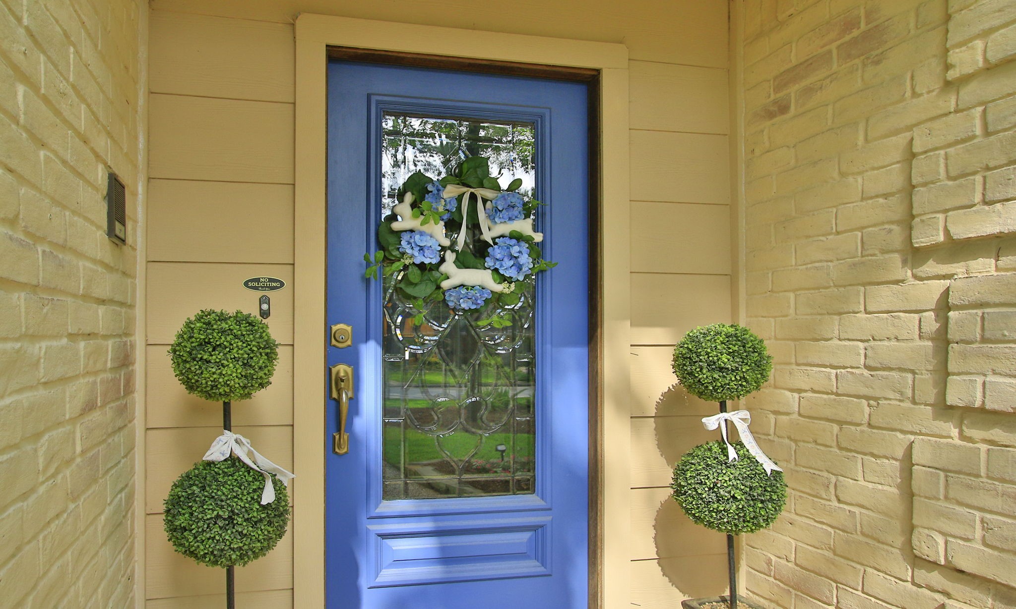 9546 Enstone Circle Spring, TX 77379 - Photo 4 of 44 A charming and inviting front covered entry welcomes you with a striking blue door featuring decorative glass detailing.