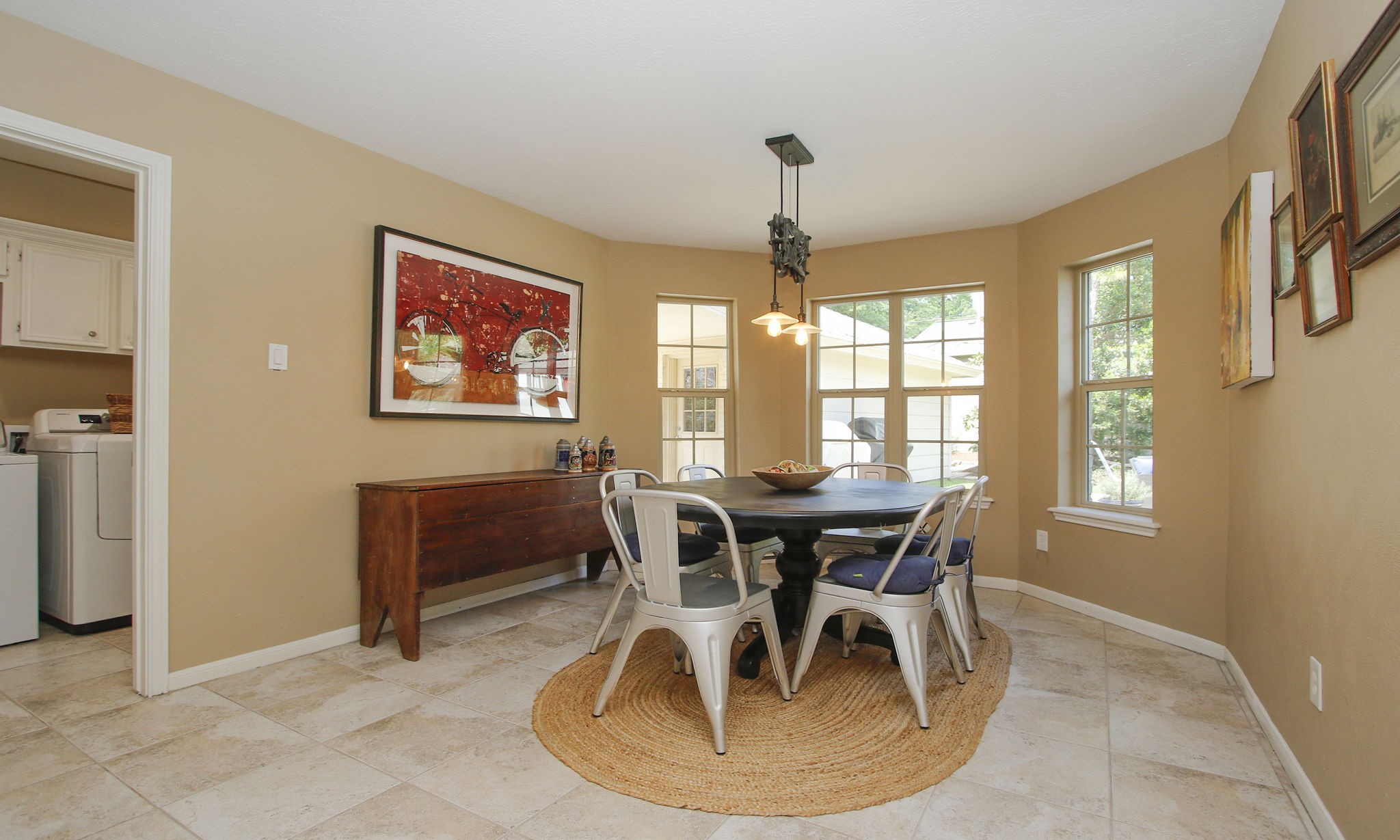 9546 Enstone Circle Spring, TX 77379 - Photo 10 of 44 Spacious breakfast area with great view of the back yard and laundry room to the left.