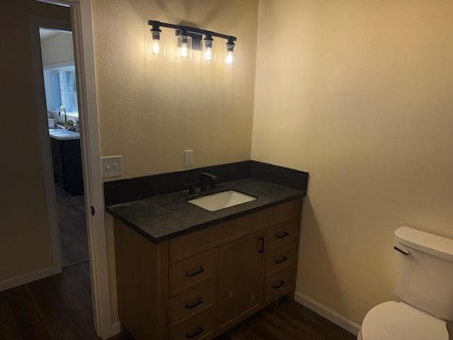 1860 Magnolia Street Gridley, CA 95948 - Photo 12 of 19 a bathroom with a granite countertop sink and a toilet
