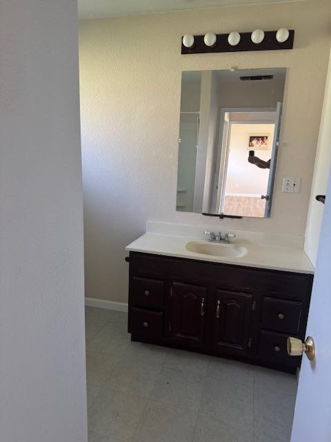 1860 Magnolia Street Gridley, CA 95948 - Photo 2 of 19 a bathroom with a sink and a mirror