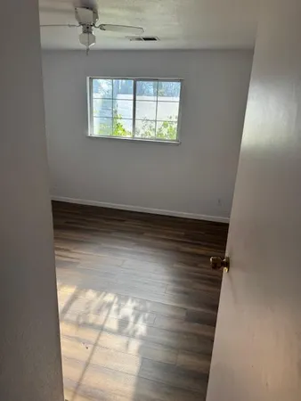 a view of an empty room and window