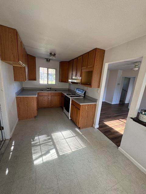 1860 Magnolia Street Gridley, CA 95948 - Photo 6 of 19 a kitchen with stainless steel appliances granite countertop a sink a stove top oven a refrigerator and dishwasher