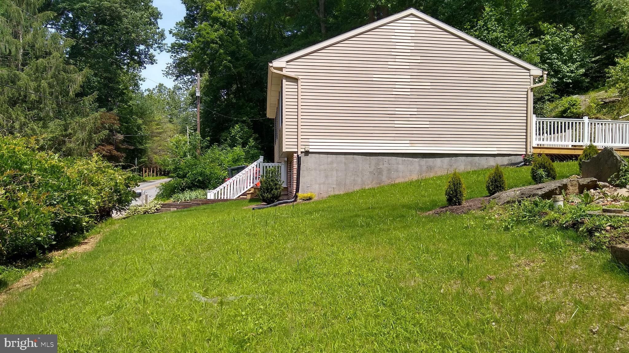 532 Bridge Valley Road Pequea, PA 17565 - Photo 22 of 43 a view of a house with a yard and sitting area