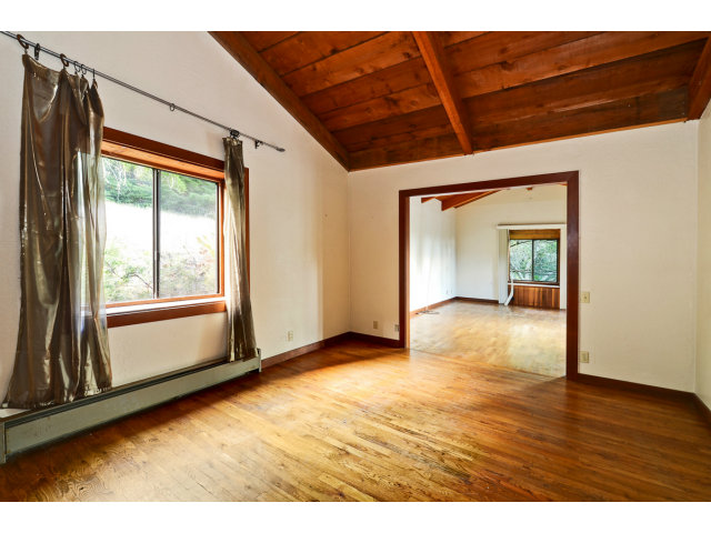 139 Bohnen Road Santa Cruz, CA 95065 - Photo 18 of 25 a view of an empty room with wooden floor and a window