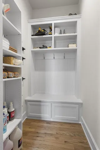 a big room with windows and a ceiling fan