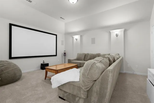 a bedroom with a bed and a tv