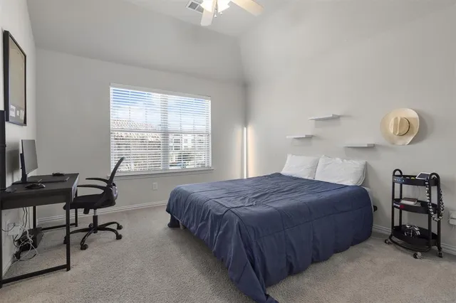 a bed room with a bed and a chandelier
