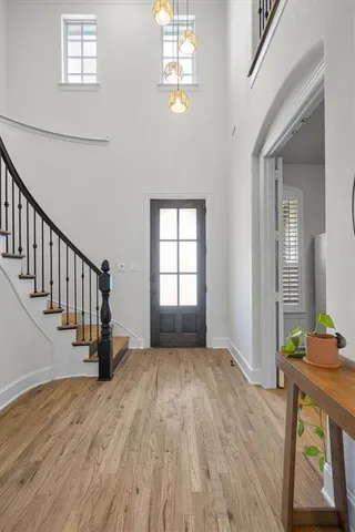 a view of a workspace with furniture and wooden floor