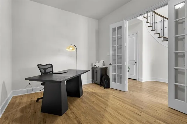 wooden floor in an empty room with a window