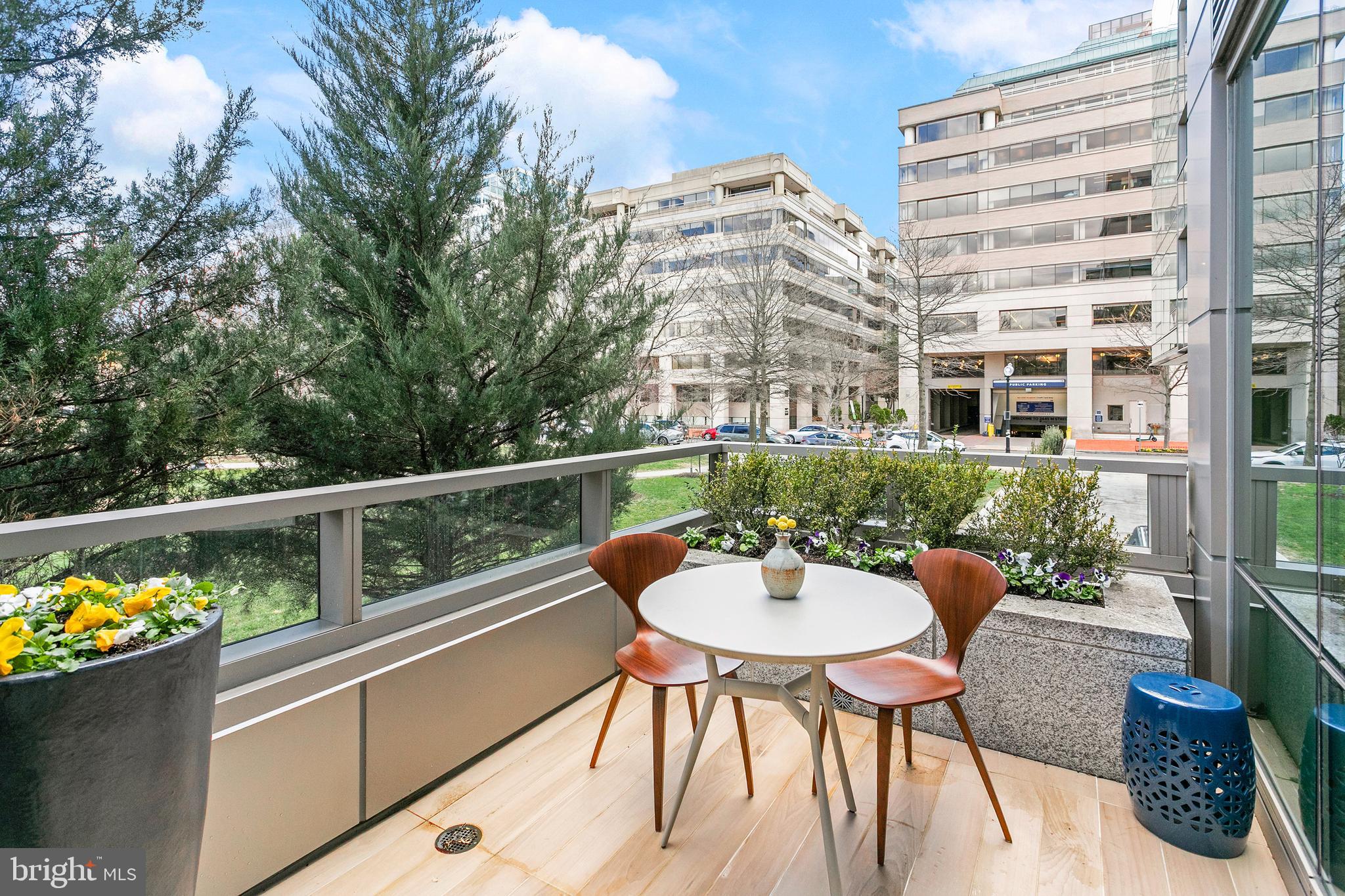 2501 M Street Northwest, Unit T12 Washington, DC 20037 - Photo 14 of 46 a balcony with table and chairs