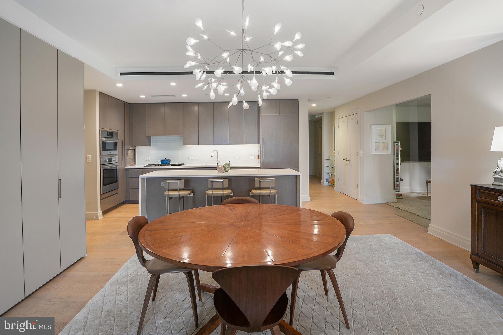 2501 M Street Northwest, Unit T12 Washington, DC 20037 - Photo 20 of 46 a view of a dining room with furniture and chandelier