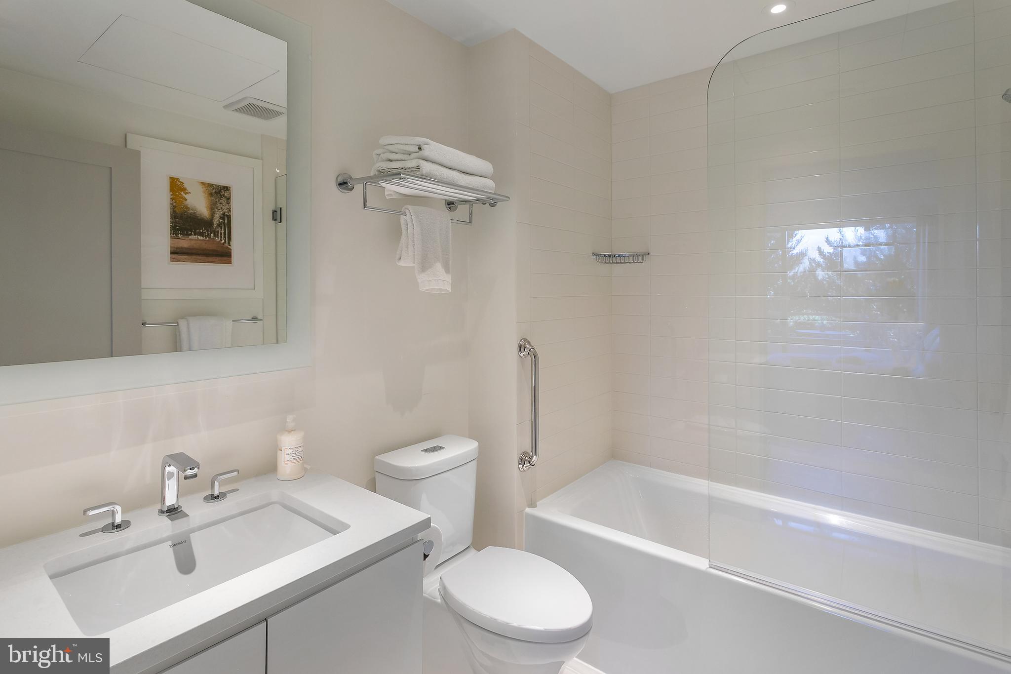 2501 M Street Northwest, Unit T12 Washington, DC 20037 - Photo 32 of 46 a bathroom with a sink a toilet and shower