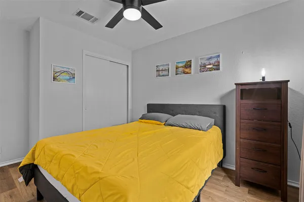 a bedroom with a bed and a closet