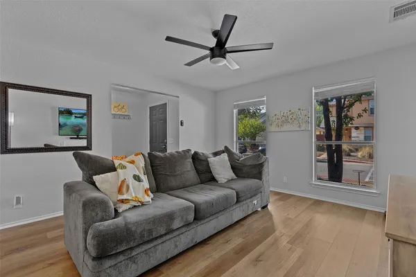 a living room with furniture and a window