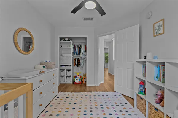 a kitchen with stainless steel appliances a chimney a sink and a cabinets