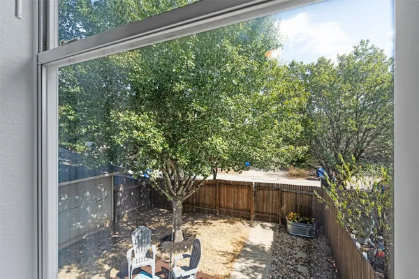 a view of balcony with wooden floor