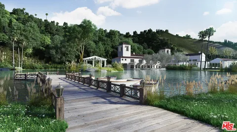 a view of a lake with houses with outdoor space