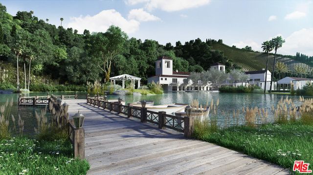 a view of a lake with houses with outdoor space