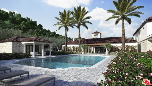 a view of a house with swimming pool and sitting area