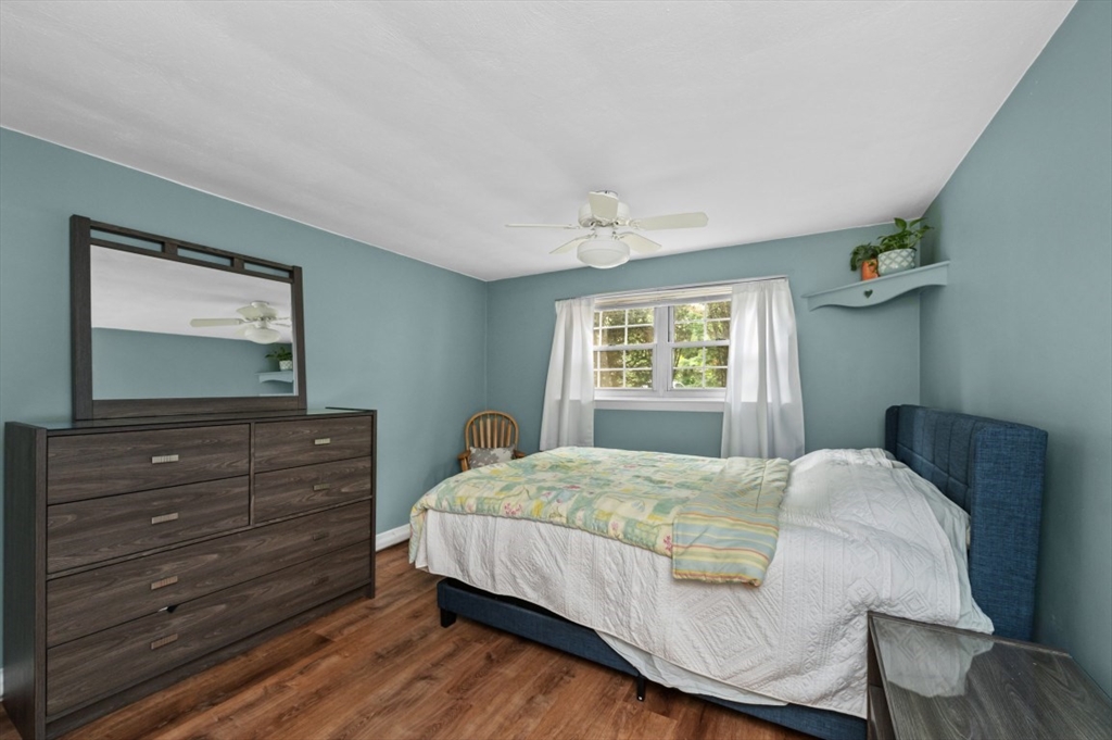 68 Preston Street, Unit 5F Wakefield, MA 01880 - Photo 11 of 20 a bedroom with a bed and a mirror on dresser
