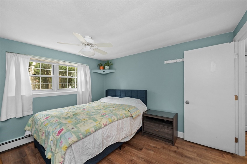 68 Preston Street, Unit 5F Wakefield, MA 01880 - Photo 12 of 20 a bedroom with a bed and a window