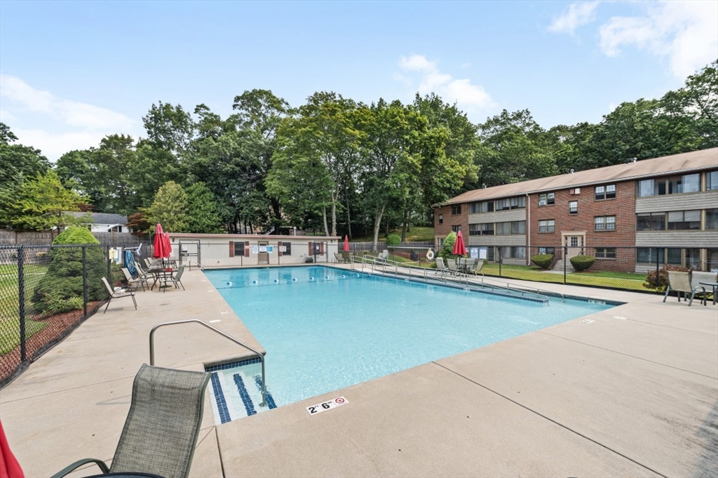 68 Preston Street, Unit 5F Wakefield, MA 01880 - Photo 18 of 20 swimming pool view with a seating space and a ocean view in the background