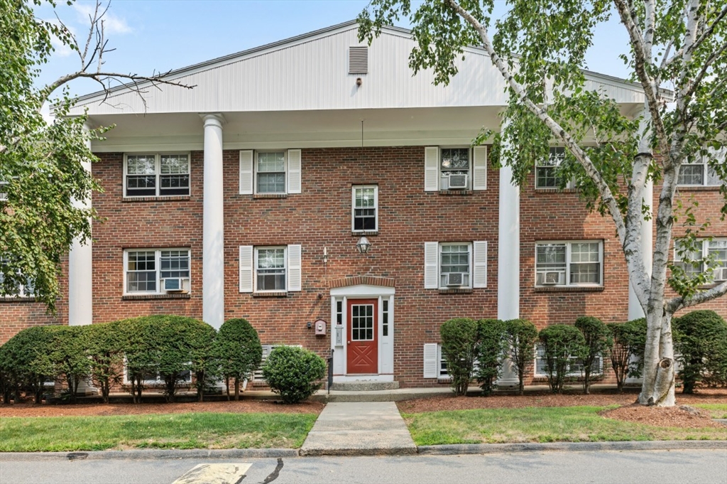 68 Preston Street, Unit 5F Wakefield, MA 01880 - Photo 2 of 20 a front view of a house with a yard