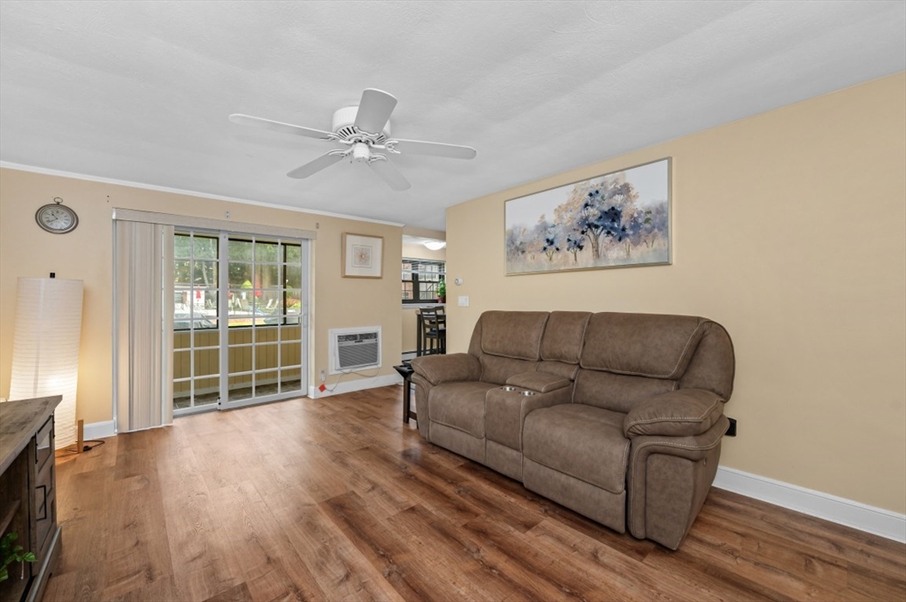 68 Preston Street, Unit 5F Wakefield, MA 01880 - Photo 9 of 20 a living room with furniture and a large window