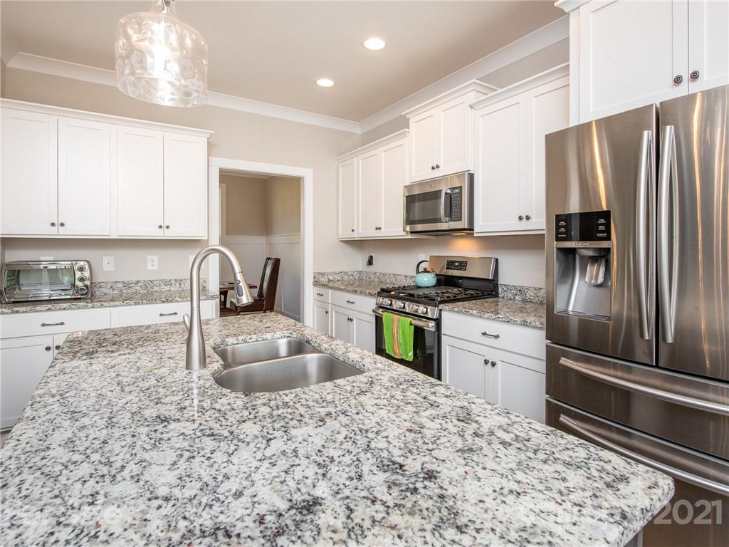 763 Red Spruce Road York, SC 29745 - Photo 2 of 43 a kitchen with granite countertop a refrigerator sink and stove