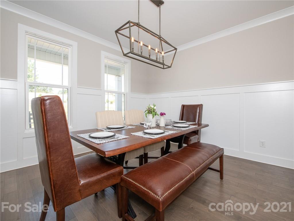 763 Red Spruce Road York, SC 29745 - Photo 12 of 43 a view of a dining room with furniture window and wooden floor