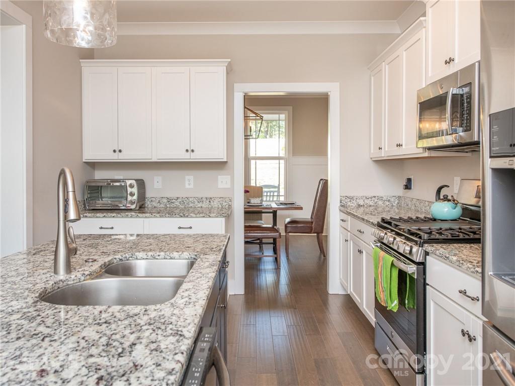 763 Red Spruce Road York, SC 29745 - Photo 15 of 43 a kitchen with a stove sink and cabinets