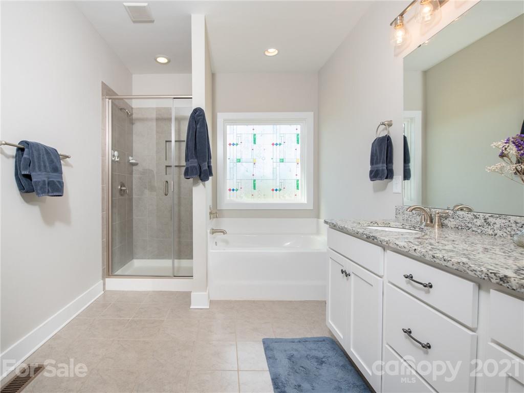 763 Red Spruce Road York, SC 29745 - Photo 25 of 43 a bathroom with a tub sink and mirror