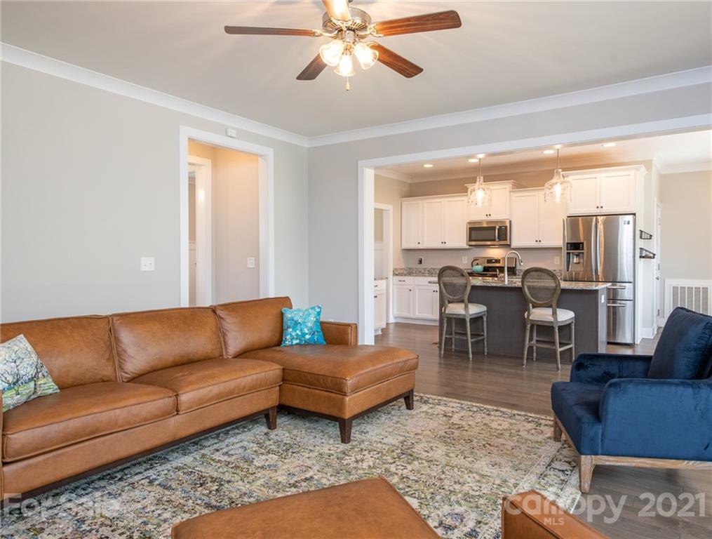 763 Red Spruce Road York, SC 29745 - Photo 4 of 43 a living room with furniture kitchen view and a chandelier