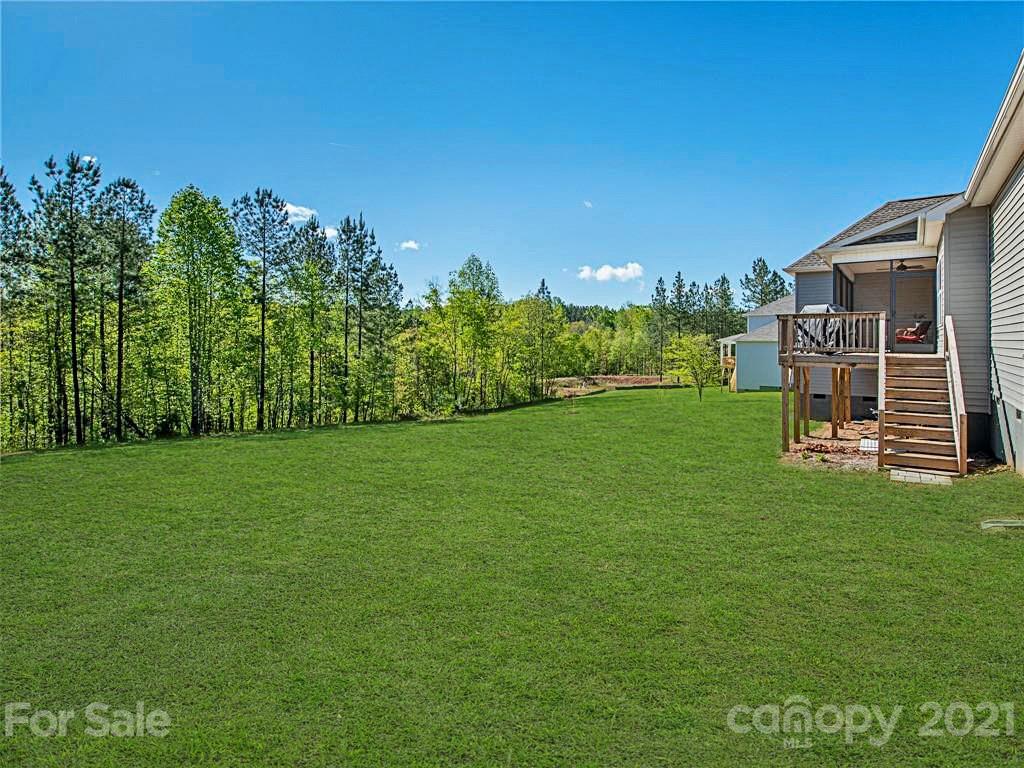 763 Red Spruce Road York, SC 29745 - Photo 33 of 43 a green field with trees in the background