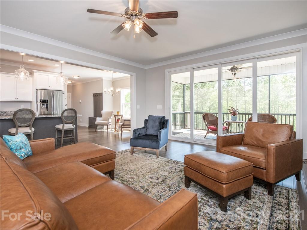 763 Red Spruce Road York, SC 29745 - Photo 36 of 43 a living room with furniture large windows and wooden floor