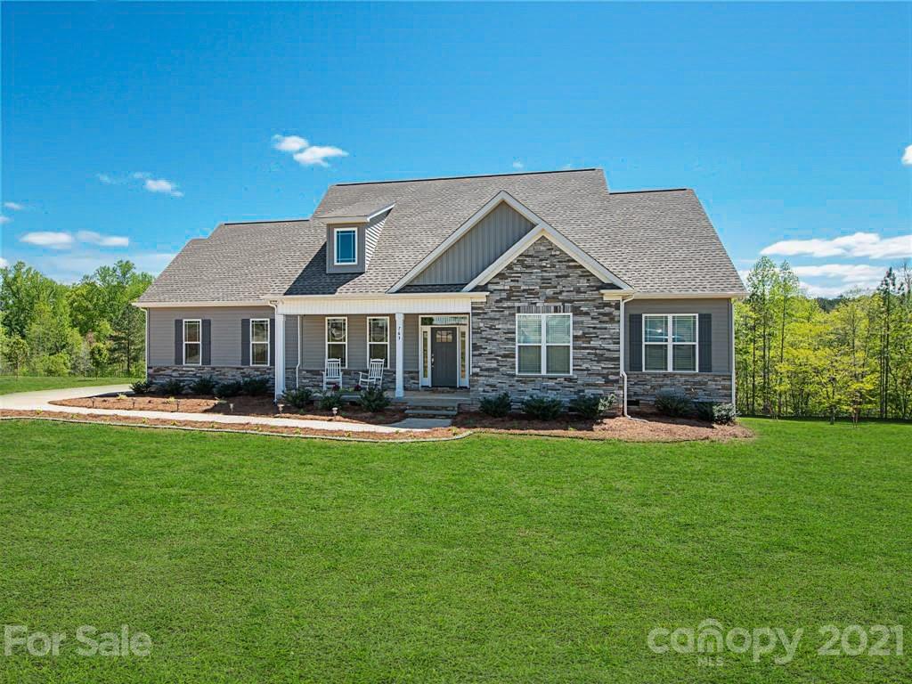 763 Red Spruce Road York, SC 29745 - Photo 38 of 43 a front view of a house with a garden and porch