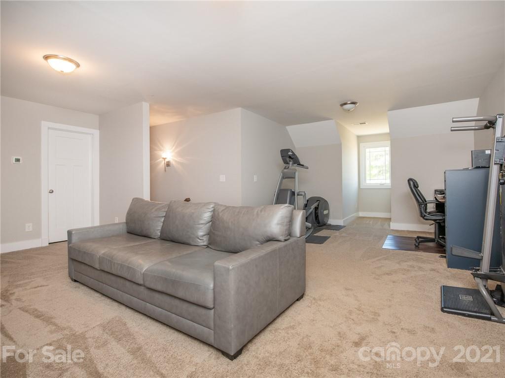 763 Red Spruce Road York, SC 29745 - Photo 5 of 43 a living room with furniture gym equipment and a flat screen tv