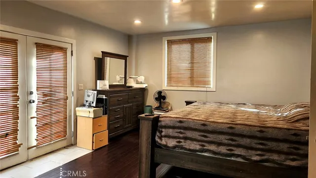 a bed room with a bed and a window