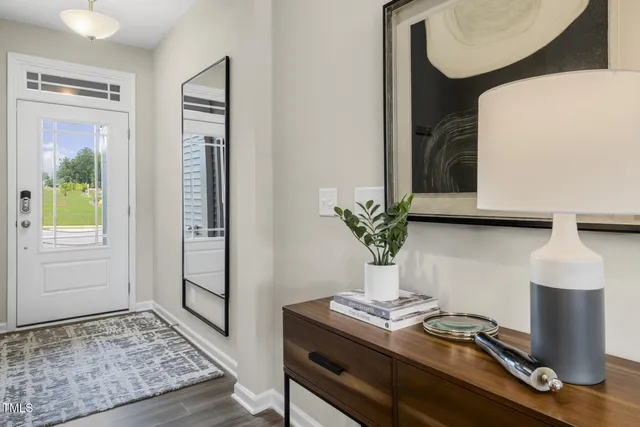 a bedroom with a bed couch and painting on the wall