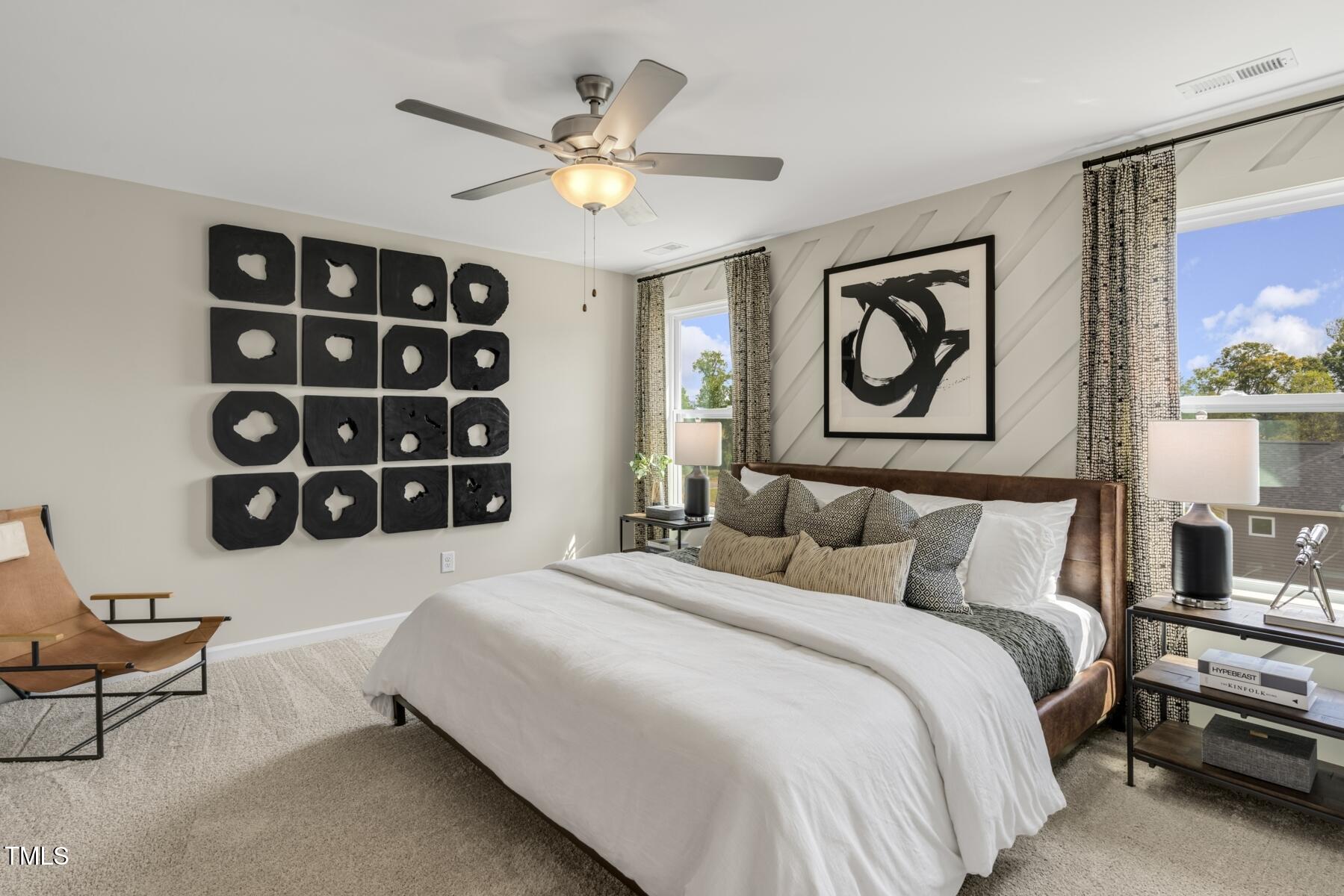 132 Siebold Street Garner, NC 27529 - Photo 29 of 35 a bedroom with a bed and a wall painting